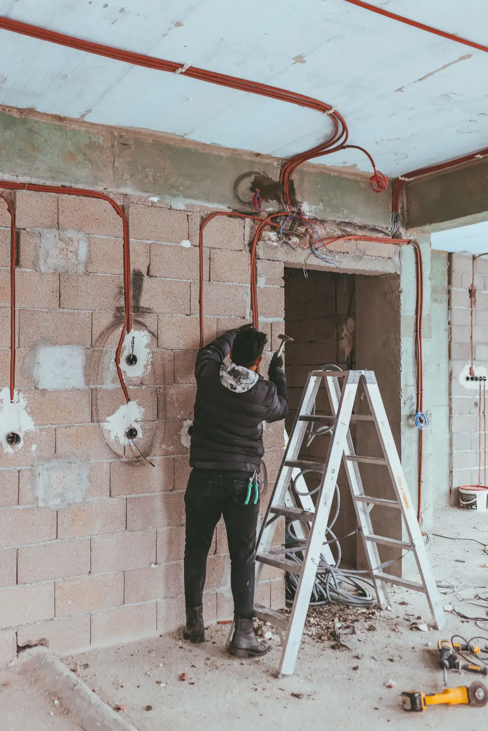 Electrician running new wiring during a home renovation