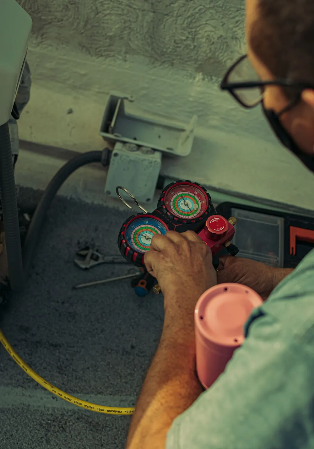 Close-up of a manifold gauge set, the diagnostic tool a technician uses to trace furnace and HVAC faults